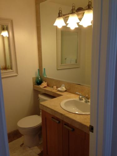 a bathroom with a sink and a toilet and a mirror at Redondo Beach / Hermosa Beach in Redondo Beach
