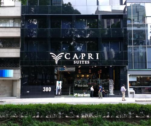 a store front of a building with people standing outside at Suites Capri Reforma Ángel 380 in Mexico City