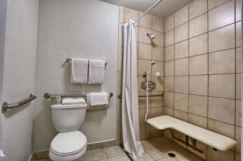a bathroom with a toilet and a shower at Cathedral Hill Hotel in San Francisco
