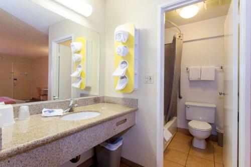 a bathroom with a sink and a toilet at Cathedral Hill Hotel in San Francisco
