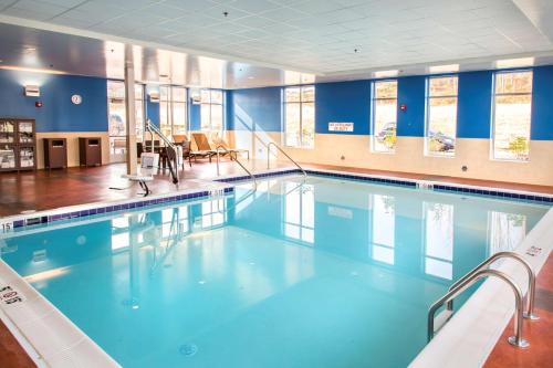 a large swimming pool with blue water at Hyatt Place Charlottesville in Charlottesville