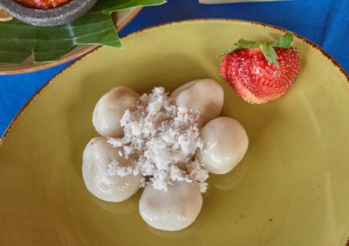 a plate of food with a strawberry and snow at Cocotinos Sekotong Lombok in Sekotong