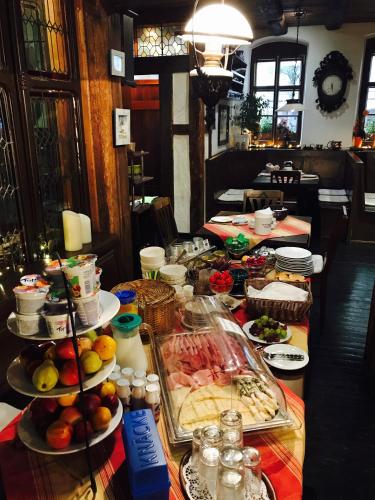 a long table with many plates of food on it at Zum Fehmelbauer in Karlstadt