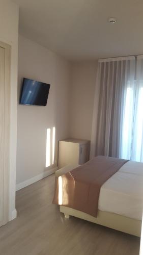 Letto o letti in una camera di Hotel Villa Barsanti