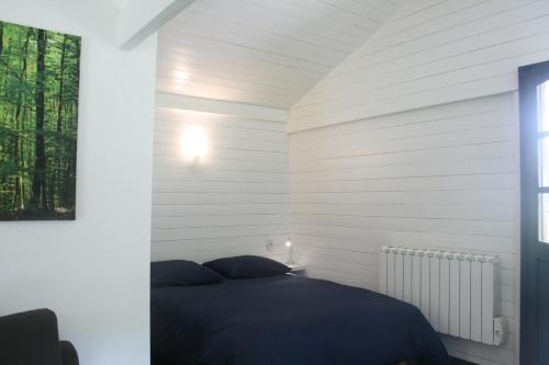 Posteľ alebo postele v izbe v ubytovaní Chalet au Coeur de Foret Gouvieux