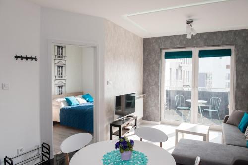 Posteľ alebo postele v izbe v ubytovaní Apartament Winogrady Hawelańska