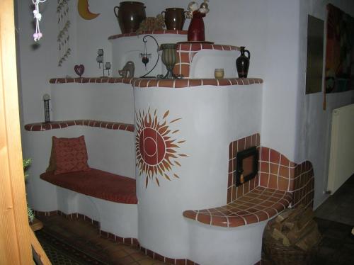 a corner of a room with a fire place at Gästehaus Schleich in Bad Radkersburg
