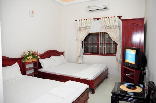 Giường trong phòng chung tại Diep Anh Guest House