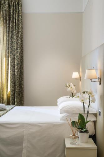 Ein Bett oder Betten in einem Zimmer der Unterkunft Hotel Ariston & Spa