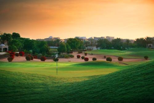 a view of a golf course with a green at Address Montgomerie in Dubai