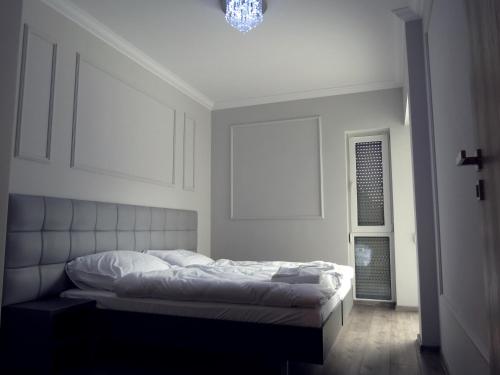 Apartamenty Baltic Inn tesisinde bir odada yatak veya yataklar