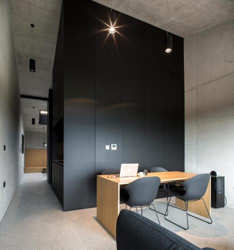 an office with a table and chairs and a laptop at Fana Estate in Dobrovo
