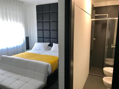 Un pat sau paturi într-o cameră la Hotel Pex Padova