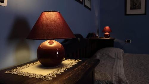 a lamp sitting on top of a table at B&B S'Asilo Sardegna in Banari
