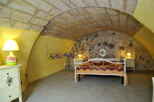 سرير أو أسرّة في غرفة في Villa Rosina