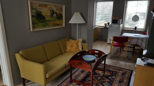 a living room with a couch and a table at Østergade 46 in Tønder