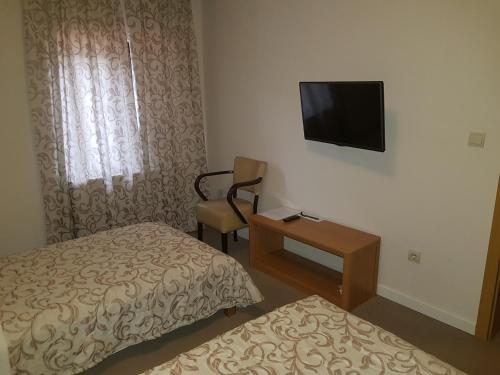 Postel nebo postele na pokoji v ubytování Hotel Dvor