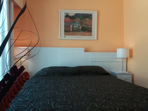 Una cama o camas en una habitación de Nuevo Hotel Plaza