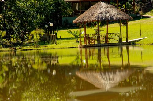 a small gazebo in the middle of a body of water at Pousada Valle dos Pássaros in Penedo