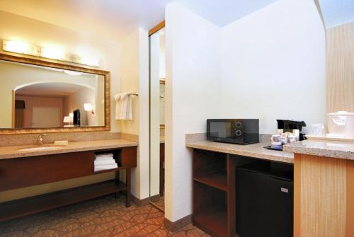 a bathroom with a sink and a mirror at Best Western San Dimas Hotel & Suites in San Dimas