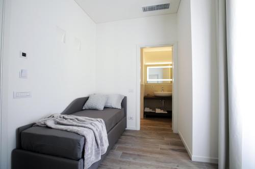 a bedroom with a bed and a sink and a mirror at Villa Liberty in Como