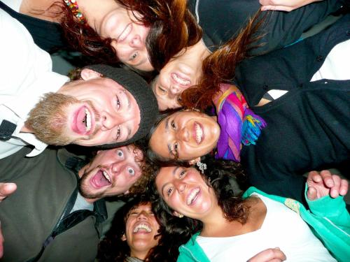 a group of people standing in a huddle at Pirwa Backpackers Colonial in Cusco