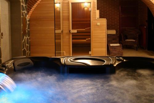 a hot tub in the middle of a house at Hotel Green Gondola in Plzeň