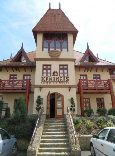 a large building with stairs leading up to it at Tapolca Fogadó in Miskolctapolca