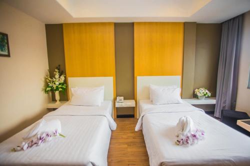 Кровать или кровати в номере New Travel Lodge Hotel