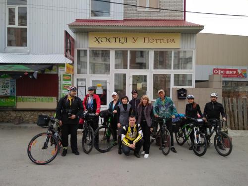 a group of people posing for a picture with their bikes at У Поттера in Ternopilʼ