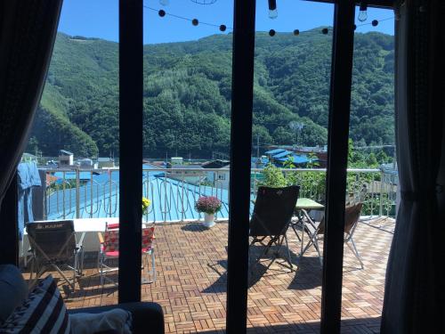 a view of a patio with a table and chairs at Us on Earth Guesthouse in Danyang