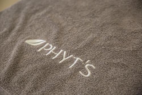 a close up of the word faith written in the sand at Appart Hotel Charles Sander in Salins-les-Bains