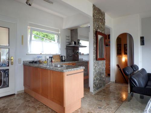 a kitchen with a large island in a room at Casa Laluni in Porto Valtravaglia