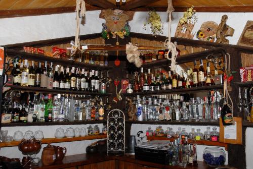 a bar filled with lots of bottles of alcohol at Туристично розважальний комплекс "Стіжок" in Berehomet