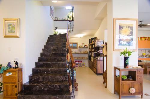 a staircase in a store with a stair case at XinFu Traveler Inn in Taiping