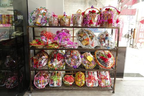 a shelf full of candy in plastic bags at Hotel Popular in Amritsar