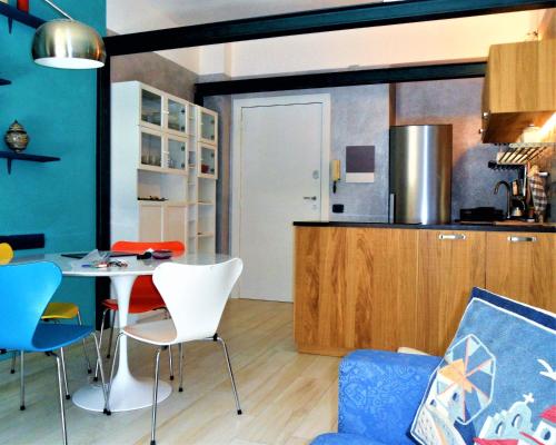 a kitchen and dining room with a table and chairs at 4effe Home in Sestri Levante