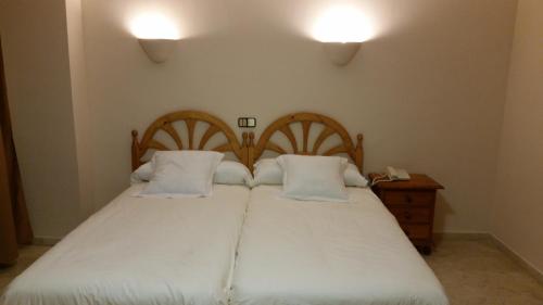 Hotel Balcón de Cazorla tesisinde bir odada yatak veya yataklar