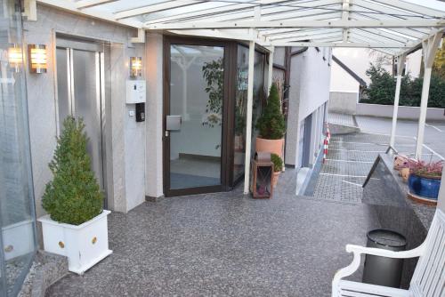 an entrance to a building with a glass door at Hotel Lutter in Munich