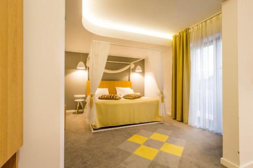 Postel nebo postele na pokoji v ubytování Horeum Boutique Hotel
