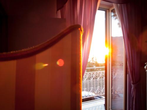 a window with a view of a balcony at Guest House a Portapalermo in Santo Stefano di Camastra