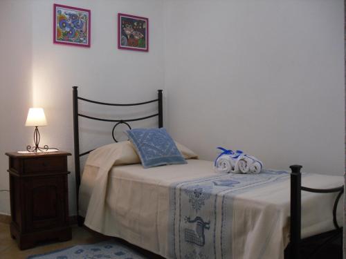 A bed or beds in a room at Nonna Murtas