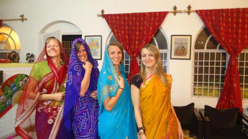 a group of women posing for a picture at The Coral Tree Boutique Homestay in Agra