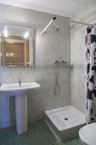 a bathroom with a sink and a toilet and a shower at UHC Larimar Family Complex in Salou