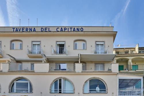 a building with a sign on top of it at Taverna Del Capitano in Massa Lubrense