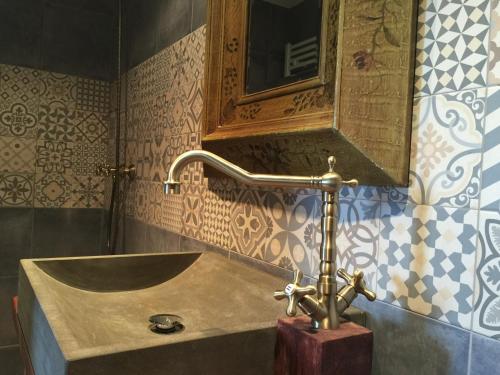 a bathroom with a sink and a mirror at Turó de la Torre in Manresa