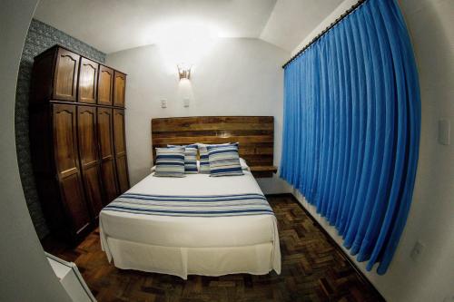 Łóżko lub łóżka w pokoju w obiekcie Pousada Casarão