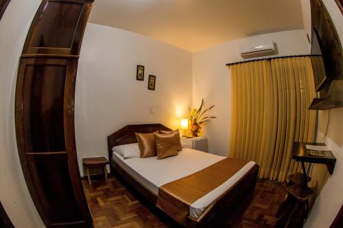 Posteľ alebo postele v izbe v ubytovaní Pousada Casarão