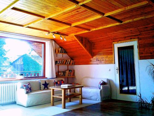 a living room with a couch and a table at Penzion Bor in Náchod