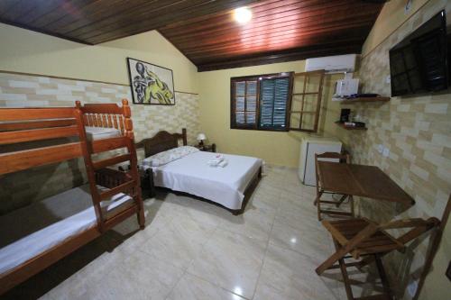 Ένα ή περισσότερα κρεβάτια σε δωμάτιο στο Pousada do Sergio